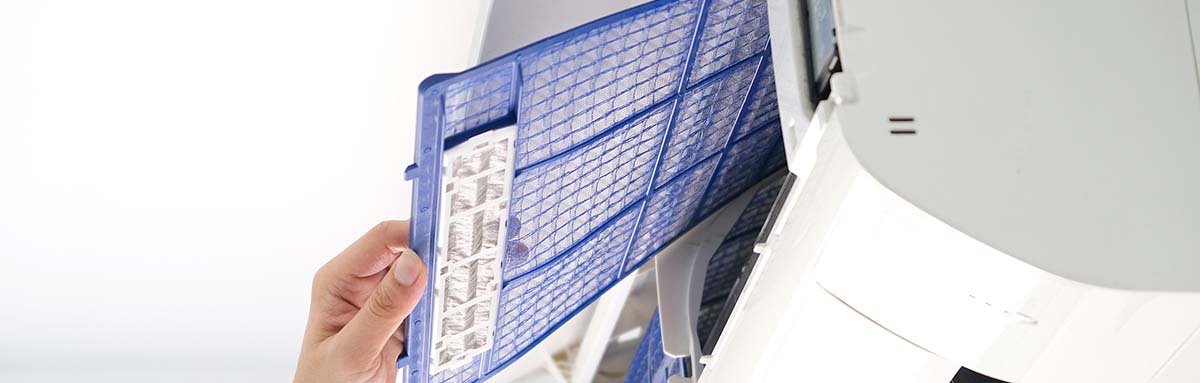 Male repair air conditioner at room, He is air technician , mechanic , engineer. Maintenance air conditioner myself.